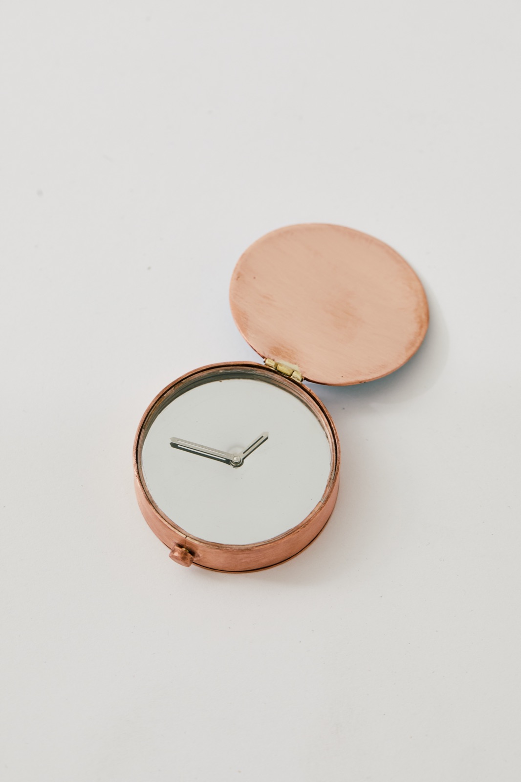 Copper pocket mirror, opened