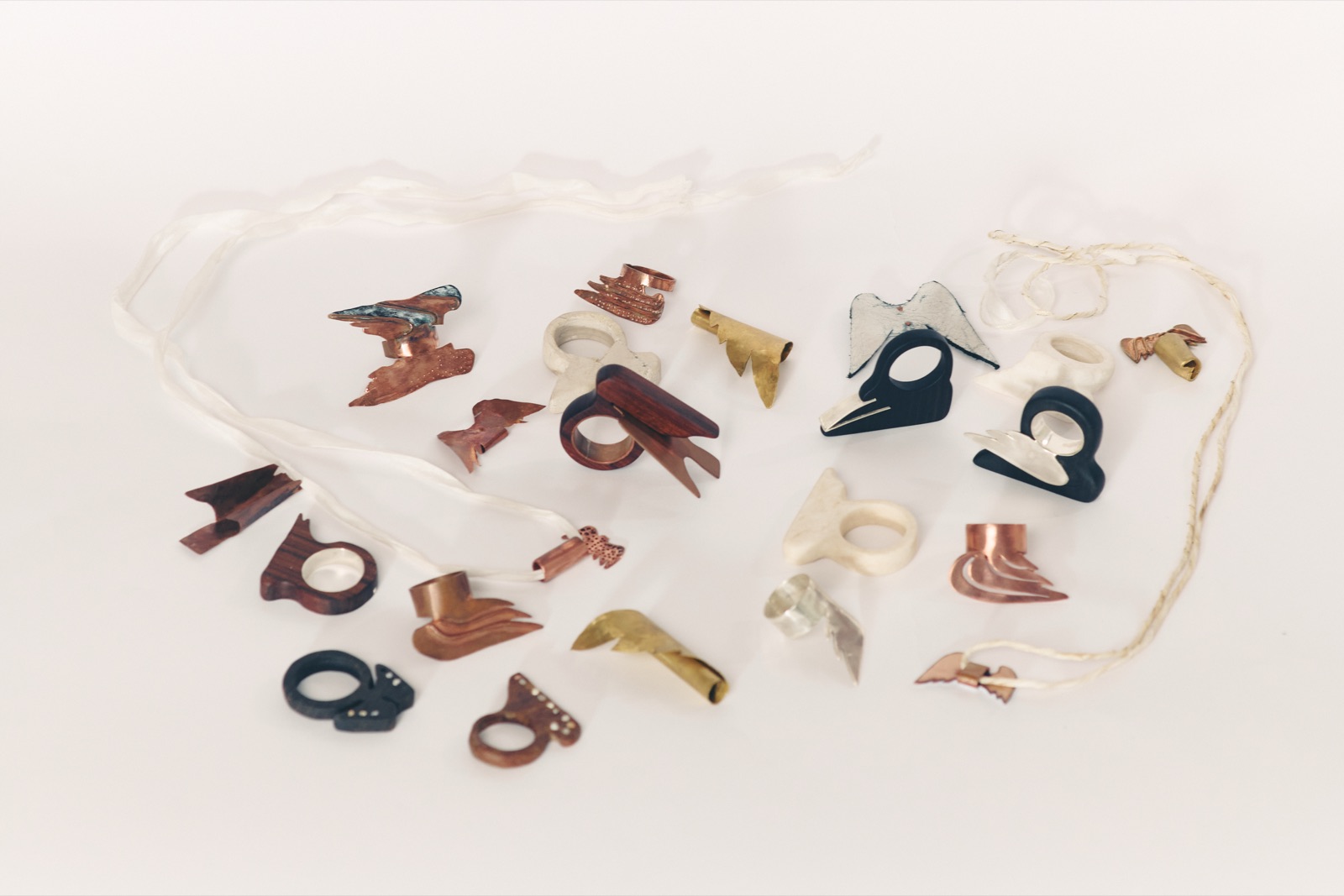 The full Angel Collection — winged rings in wood, copper, brass, bone and blackened silver